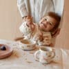 Liewood Liewood Merle Printed Cape Slab Dream / Ecru 5715493447359 Liewood Verzorging Eten & Drinken Slabbetjes Wijs west
